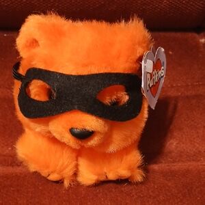 Orange Stuffed Animal with Black Mask